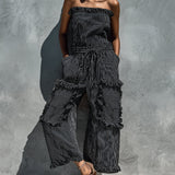 Black and white striped strapless jumpsuit with ruffles
